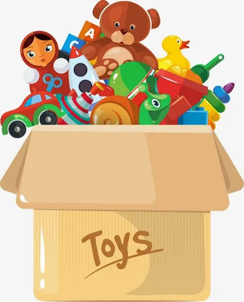 A cardboard box labeled "Toys" overflows with colorful children's toys including a teddy bear, rubber duck, toy car, rocket, and a Russian nesting doll.